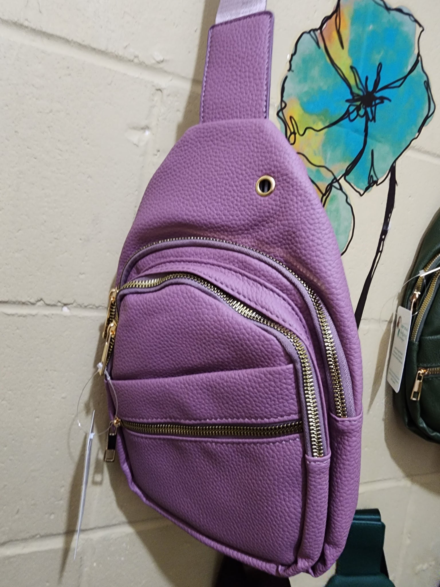 Sling bags with multi zippered pockets
