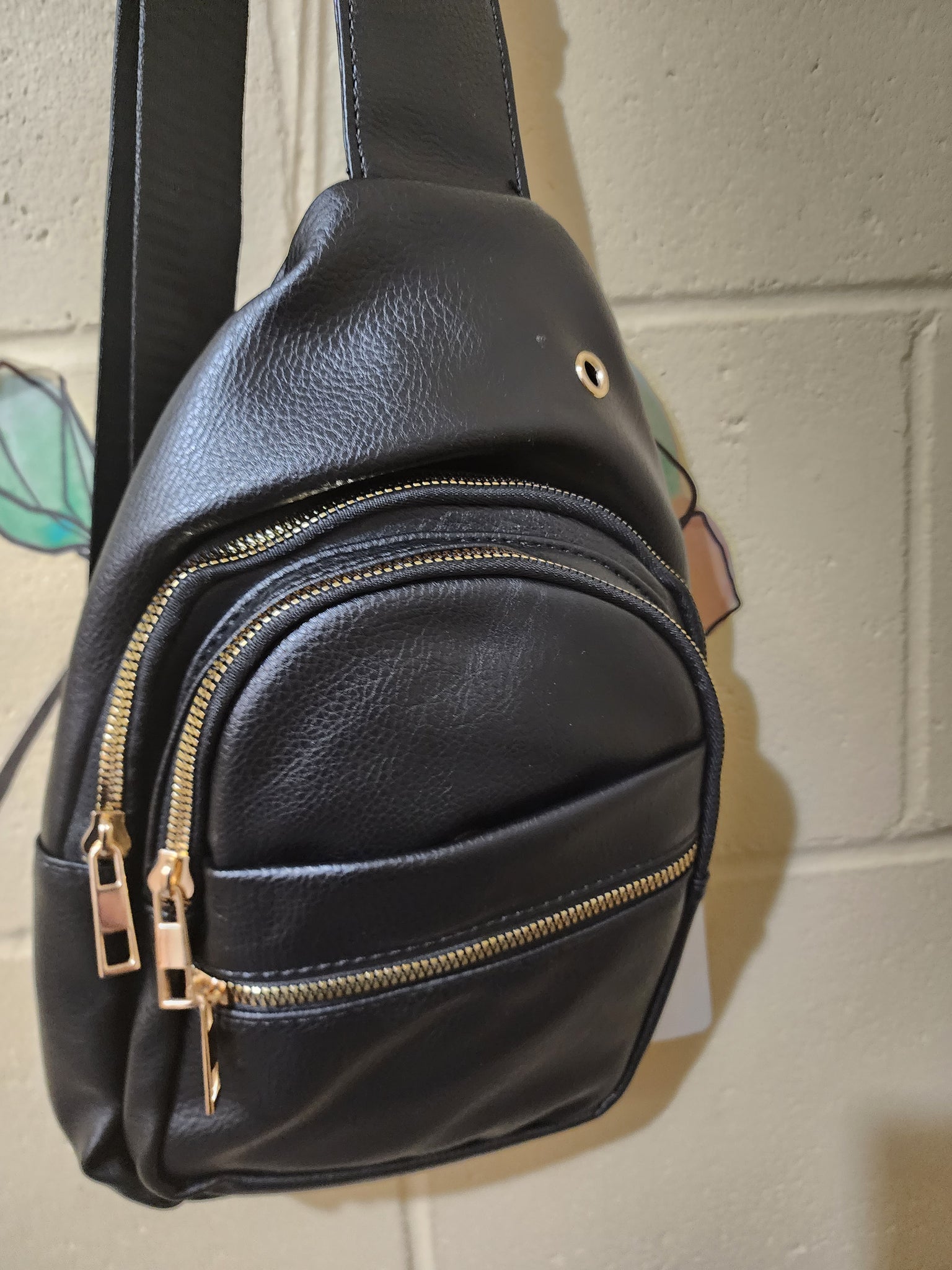 Sling bags with multi zippered pockets